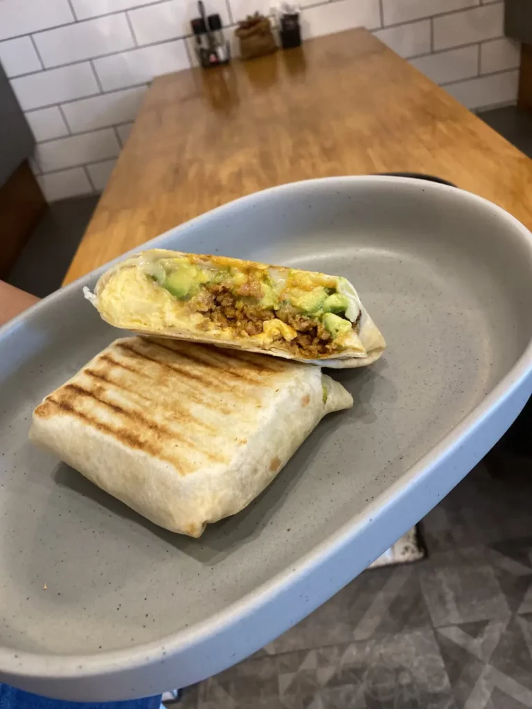 Delicious sausage, egg and avocado breakfast burrito at the one of the best places to visit in Chalong, Poached Breakfast Cafe, Chalong, Phuket, Thailand