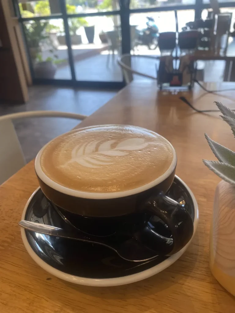 Latte on the table at the best Chalong vegetarian restaurant: Poached Breakfast Cafe, Chalong, Phuket, Thailand