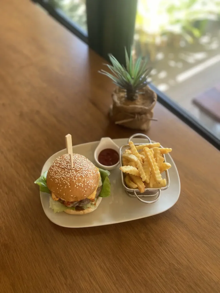 Spicy Burger with chips and ketchup. One of our 3 burgers at the best Chalong vegetarian restaurant: Poached Breakfast Cafe, Chalong, Phuket, Thailand